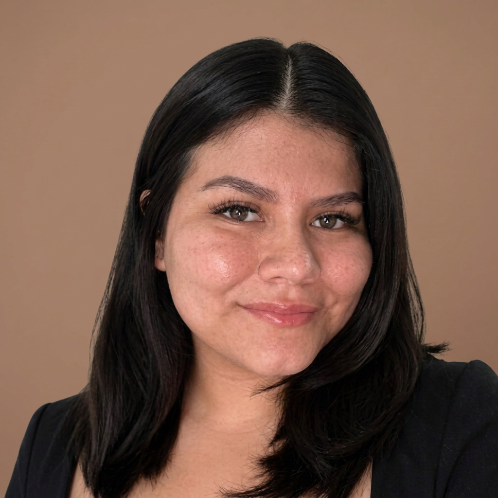 Portrait of a young woman with shoulder-length black hair and a slight smile.